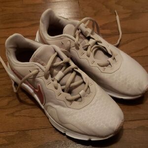 Nike Beige Sneakers with Pink Metallic Swoosh Accent